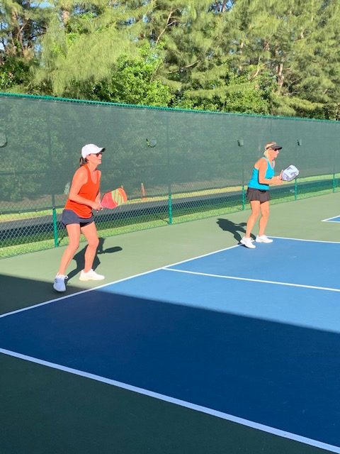 Eva and Paul in "ready position" during one of Bob's semi-private pickleball clinics in Delray Beach