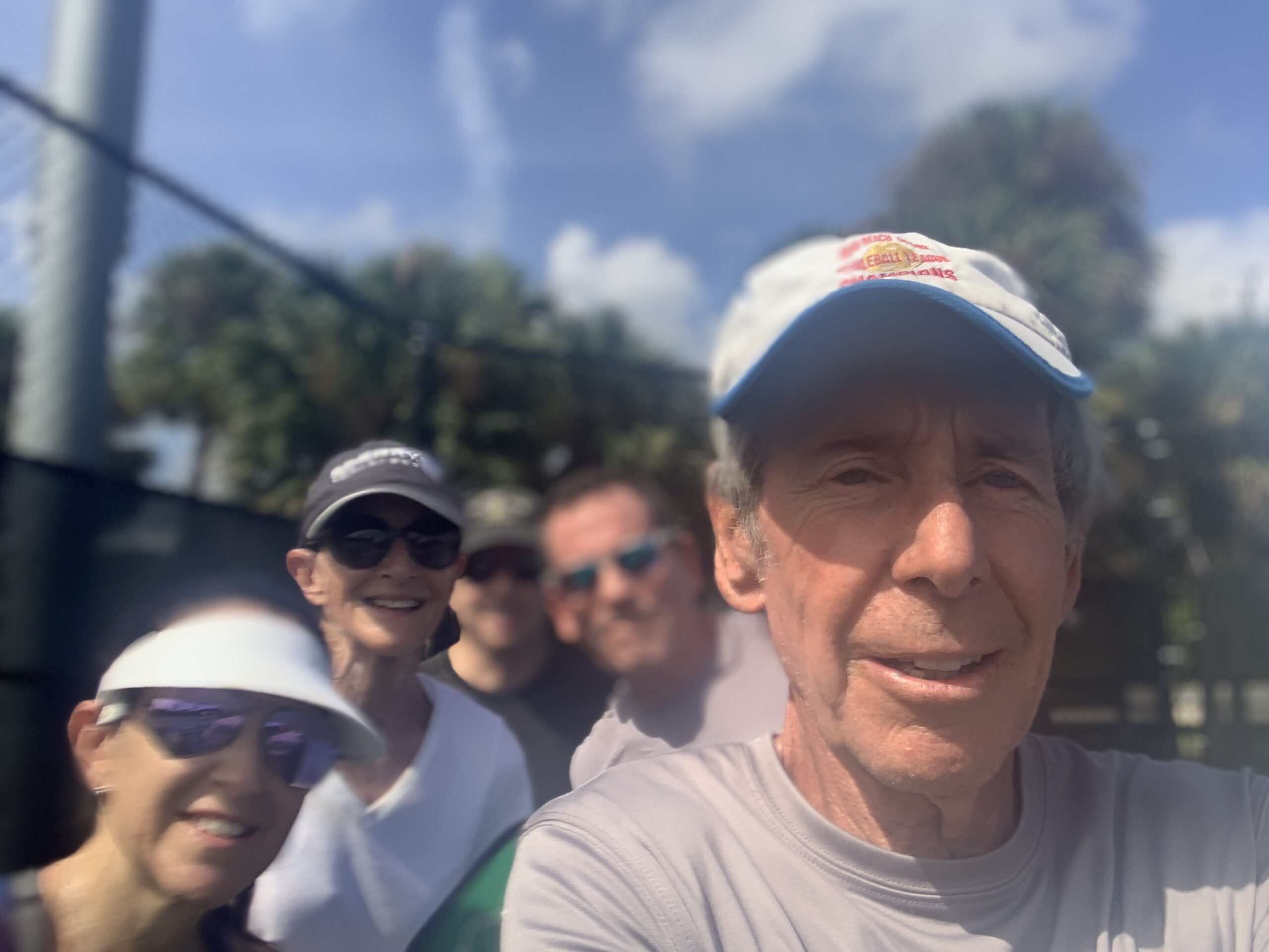 Bob with students Shaina, Jonathan, Rick, and Jane after an intermediate pickleball clinic in Lake Worth, FL. It was mid-day Florida hot, but the lesson went well.