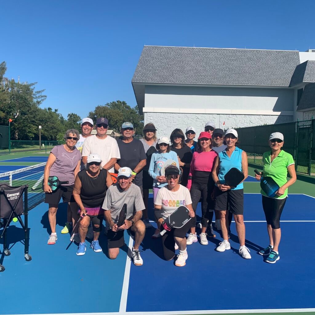 Bob Savar teaching a group of intermediate pickleball players in Delray Beach, Florida