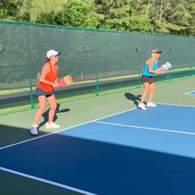 Eva and Paul in "ready position" during one of Bob's semi-private pickleball clinics in Delray Beach